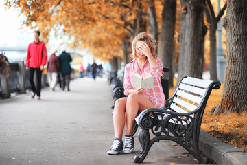 Beautiful girl in the autumn park