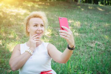 Woman taking selfie on smart phone in the street © bisonov