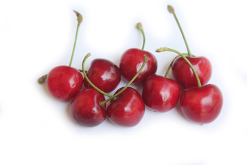 Ripe fresh cherries isolated on white background