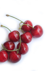 Ripe fresh cherries isolated on white background