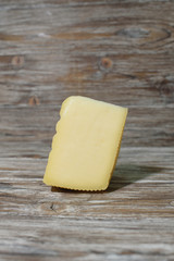 Delicious cacotta cheese which is needed drink with wine on a beautiful wooden background