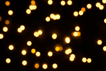 Abstract festive background with scattered lights. Holiday concept