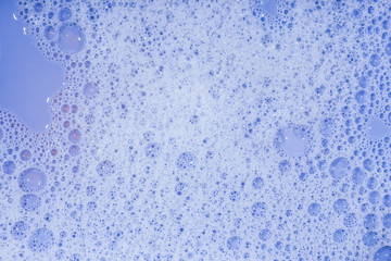 Soap bubbles background- suds liquid