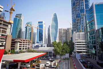 Dubai City at daylight with gas station on foreground