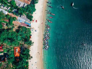 Aerial shot of long tail boats docked at the beach. Railay Beach, Ao Nang, Krabi, Thailand

