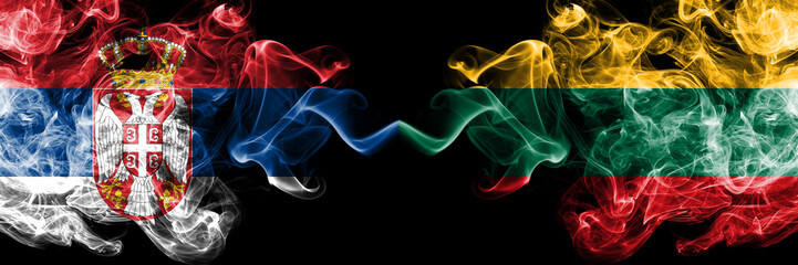 Serbia vs Lithuania, Lithuanian smoky mystic flags placed side by side. Thick colored silky smokes combination of Serbian and Lithuania, Lithuanian flag