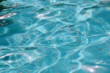 Blue ripped water in the swimming pool Swimming pool water surface background