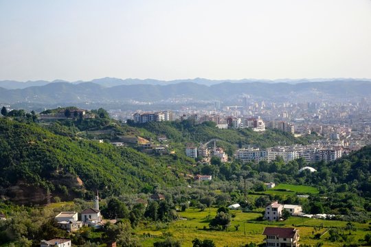 Aerial view of Tirana city ​​and outskirts, Albania. Tirana city seen from the Dajti Express (Dajti Ekspres).  Beautiful cityscape seen from the Dajti Express cable car.