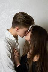 Young caucasian couple posing on white