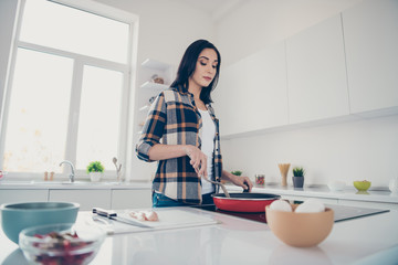 Porrait of lovely beautiful charming lady youth stand apartment use user want feast evening routine many ingredients mixing checkered shirt stylish trendy focused she her
