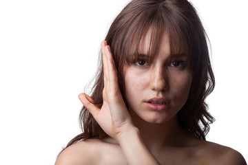 Close-up shot of a young caucasian girl with curly hair and bangs