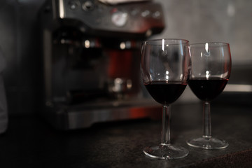Close up of red wine glasses with lipstick mark