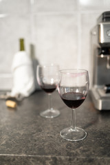 Close up of red wine glasses with lipstick mark