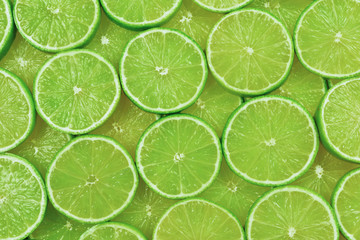Fresh lime slices as a background.