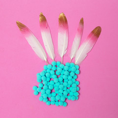 Feathers and decor. Minimal flat lay fashion art