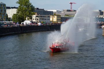 FRANKFURT, GERMANY - AUG 12, 2018: Osthafen Festival in Frankfurt am Main. Fireboat Shows Water...