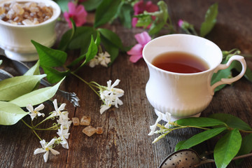 Decorative composition of vintage style: romantic tea drinking with jasmine tea