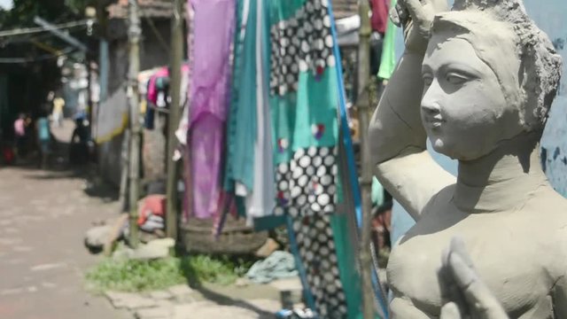 Close up Art model of Maa Durga pratima face. Goddess Durga sculpture made of clay during famous Durga Pooja Celebration. Taken from potter studio in Kumartuli, Calcutta Kolkata, West Bengal, India.