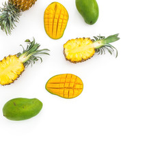 Tropic frame of pineapple and mango fruits on white background. Flat lay, top view. Tropical concept.