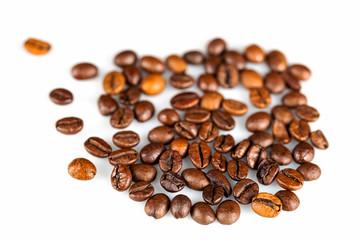Close-up coffee beans on a white background, shot with a macro lens with a diaphragm of F4