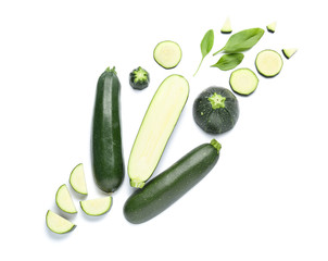Cut zucchini squashes on white background