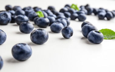 Many ripe blueberry on white background