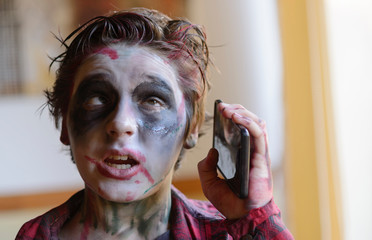 Modern zombie talking on cellphone