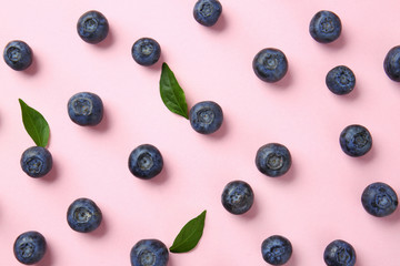 Many ripe blueberry on color background