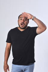 latin america man with expression of forgetfulness or surprise on white background