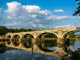 Richmond lock over still water during the day in summer.