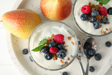 Parfaits and pears on white wooden table, space for text