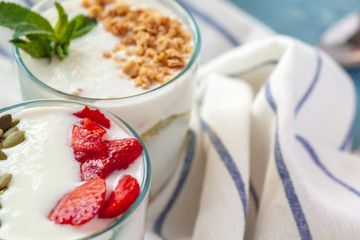Granola with yogurt and berries for healthy breakfast on a table