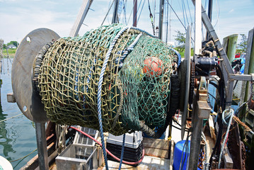 Fishing net on back of fishing trawler