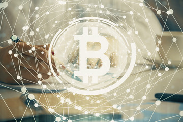 Cryptocurrency hologram over woman's hands writing background. Concept of blockchain. Double exposure