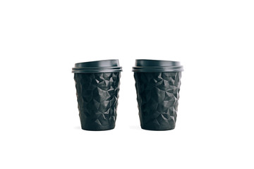 Two black coffee cups to go isolated on white. Unusual shape of cup, mock up.
