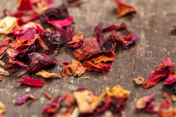 Handful of natural tea on a wodden surface