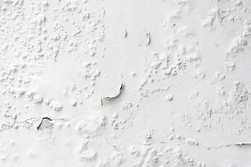 Texture of the old white wall with cracked paint