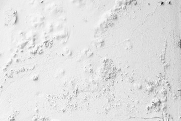Texture of the old white wall with cracked paint