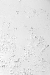 Texture of the old white wall with cracked paint
