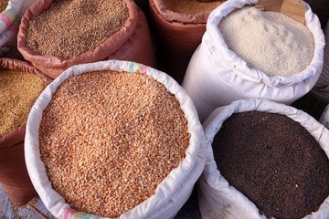 Ethiopian market street vendor with variety of food products February 2019, Bahir Dar, Ethiopia