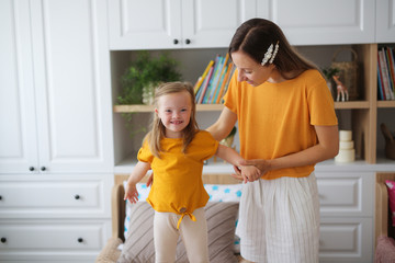 blonde mother and daughter with Down syndrome
