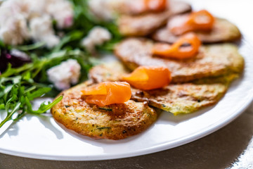 Pancakes with greek salad and salmon