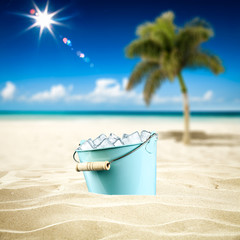 Beach background of sand and metal container with cold ice. Free space for your decoration and summer time. 