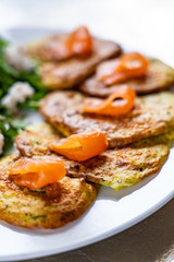 Pancakes with greek salad and salmon