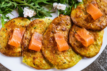 Pancakes with greek salad and salmon