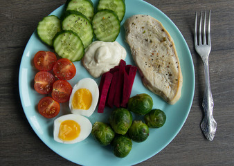 Chicken fillet, Brussels sprouts, eggs, tomatoes, cucumbers, white sauce