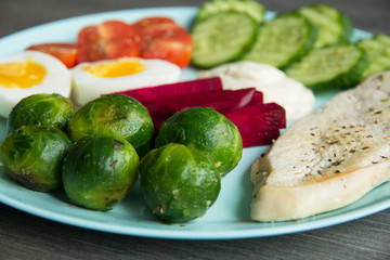 Chicken fillet, Brussels sprouts, eggs, tomatoes, cucumbers, white sauce