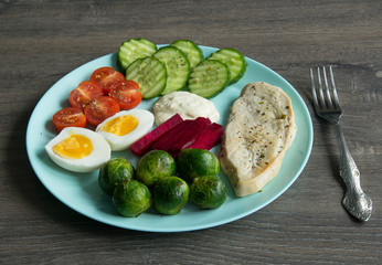 Chicken fillet, Brussels sprouts, eggs, tomatoes, cucumbers, white sauce