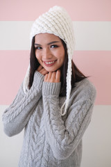 Asian girl, shot body length, is wearing a winter outfit with a cute emotion