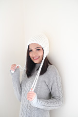 Asian girl, shot body length, is wearing a winter outfit with a cute emotion